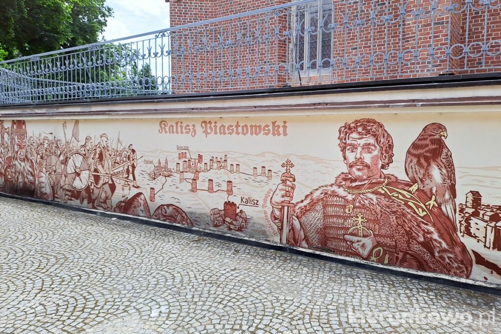 mural kalisz piastowski koło baszty i murów miejskich